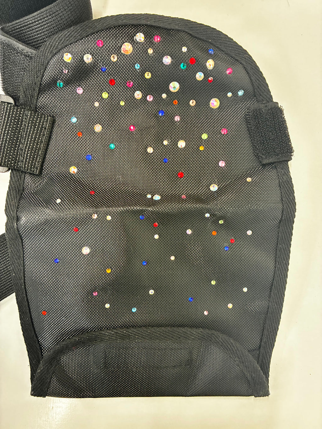 Stoma bag cover with crystals.