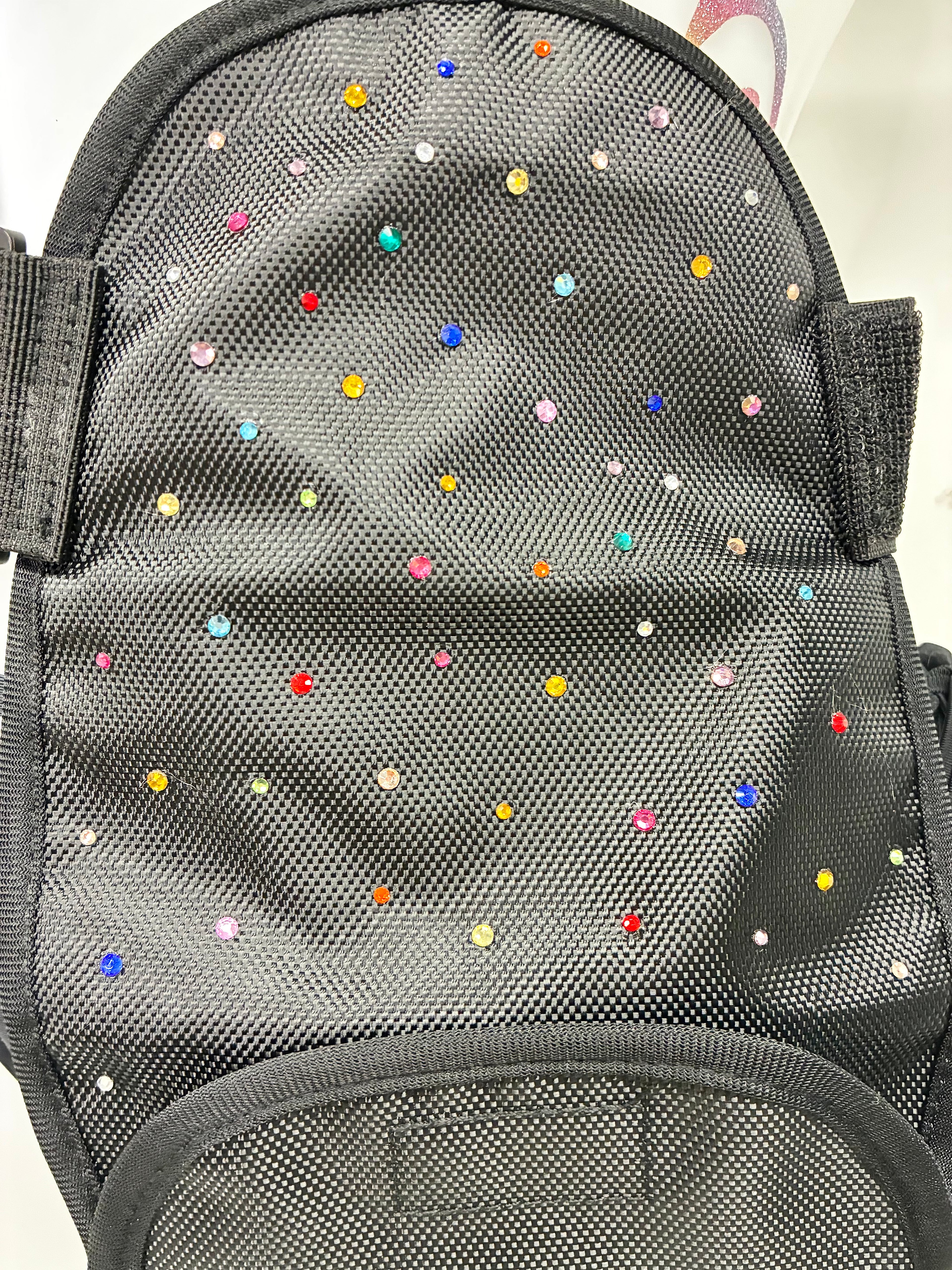 Stoma bag cover with crystals.